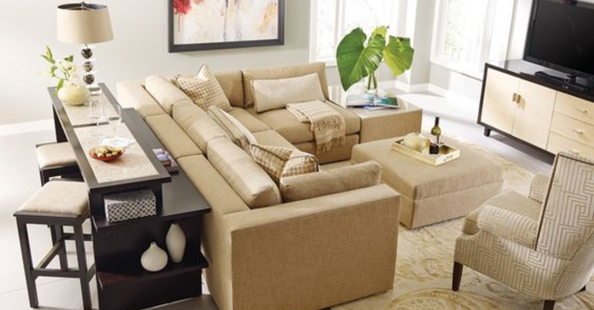 A beige sectional and chair with a coffee table in the center