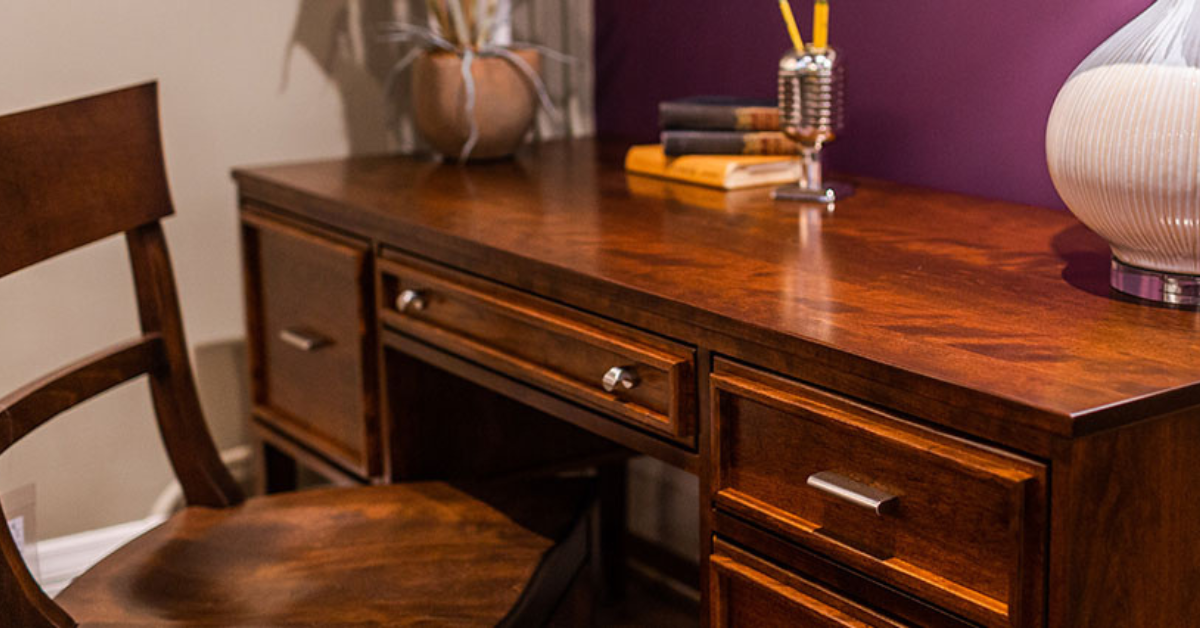 A wooden office desk and a wooden chair