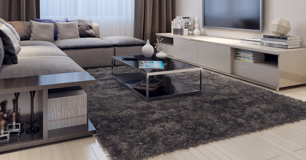 A living room set with a sections, coffee table, and dining table.
