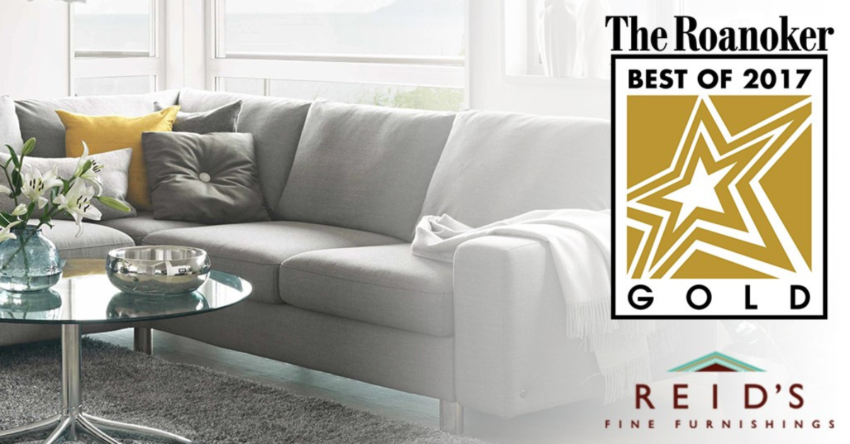 A white couch with the Roanoker Gold Star logo on top