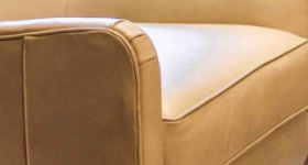 A section of a beige couch