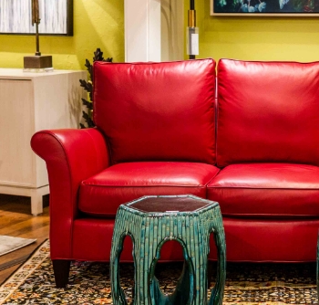 Reid's Fine Furnishings Roanoke showroom showcasing a red couch and a green and blue table