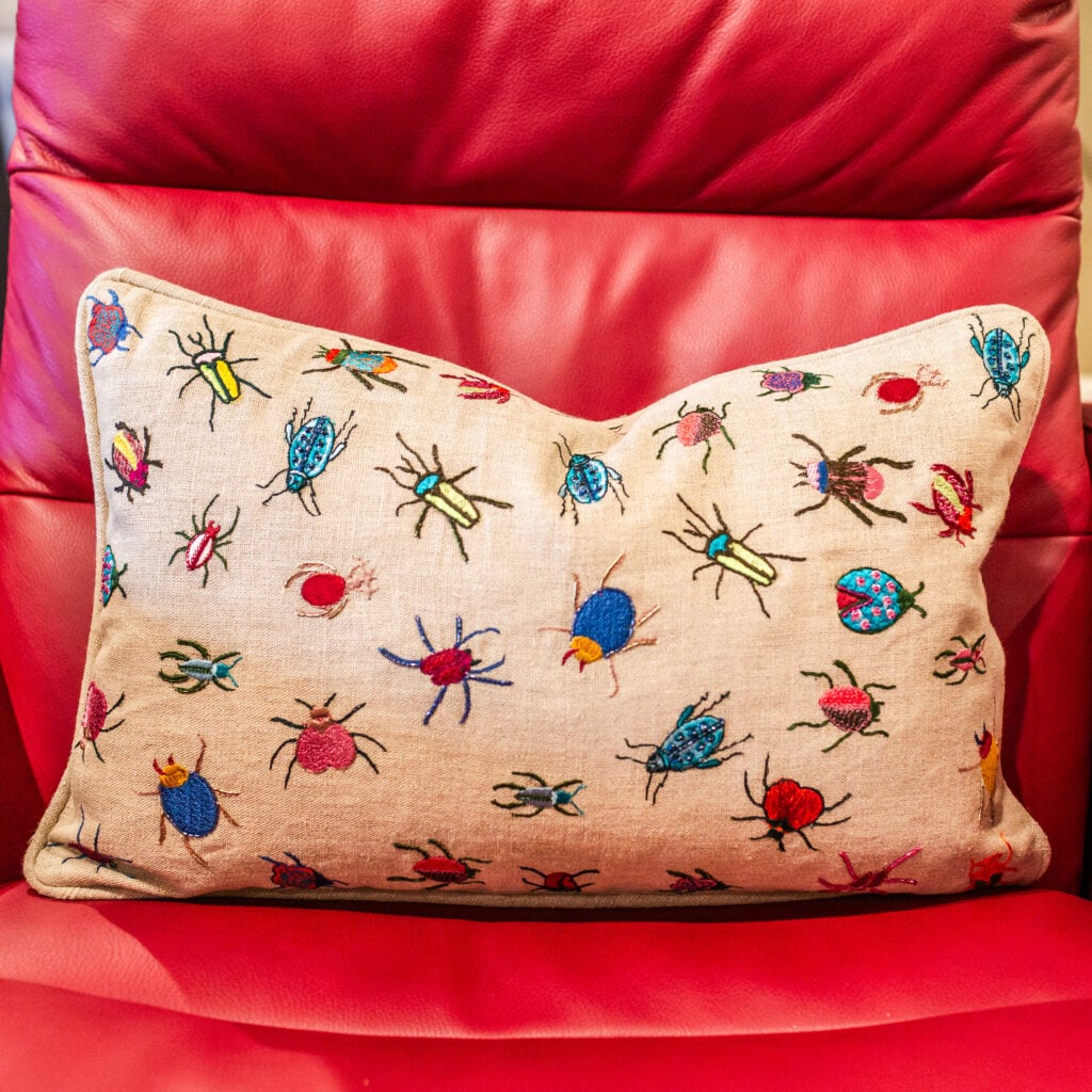 Throw pillow with insect fabric